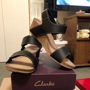 Black leather Clark’s wedges